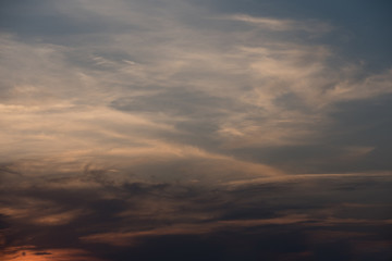 Naklejka na ściany i meble Dramatic clouds sunset background