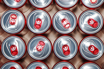 Metal cans with cooling drinks on a white background