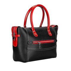 Fashionable red and black classic ladies handbag of solid textured leather with elegant handle and inserts and silver accessories of a three-apartment type, isolated on white background