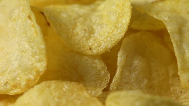 Close up of rotating potato chips. No sound.