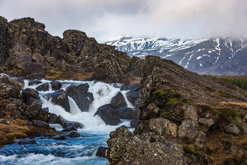 Rocky landscape and waterfall at Thingvellir National Park
