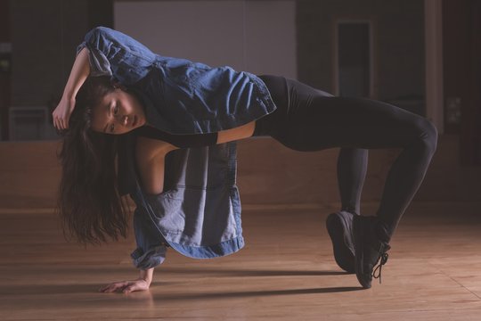 Female dancer dancing in dance studio