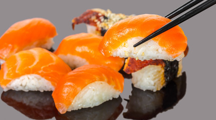 sticks keep sushi with salmon