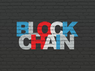 Money concept: Painted multicolor text Blockchain on Black Brick wall background