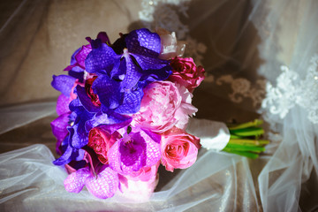 Stunning bridal bouquet. Wedding ceremony. Mix of peony, succulents, orchids and roses. Modern bridal accessories. Wedding flowers