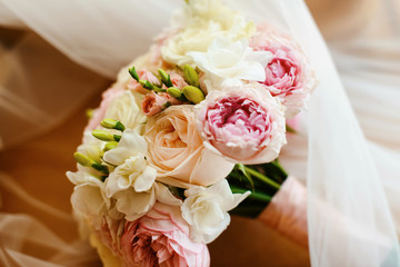 Stunning bridal bouquet. Wedding ceremony. Mix of peony, succulents, orchids and roses. Modern bridal accessories. Wedding flowers