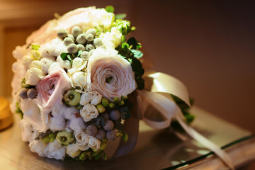 Stunning bridal bouquet. Wedding ceremony. Mix of peony, succulents, orchids and roses. Modern bridal accessories. Wedding flowers