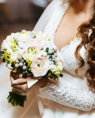 Stunning bridal bouquet. Wedding ceremony. Mix of peony, succulents, orchids and roses. Modern bridal accessories. Wedding flowers