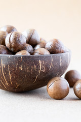 Whole Macadamia nuts in coconut bowl