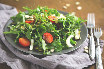 Green salad, arugula, cherry tomatoes, celery
