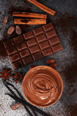 Chocolate bars on table with chocolate powder.