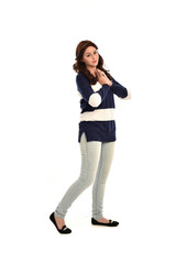 Fototapeta premium full length portrait of girl wearing striped blue and white jumper and jeans. standing pose on white studio background