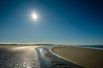 The sun is slowly setting on a September afternoon when walking along the Wadden Sea and the gorgeous coastline of the Dutch Wadden Isle of Schiermonnikoog.