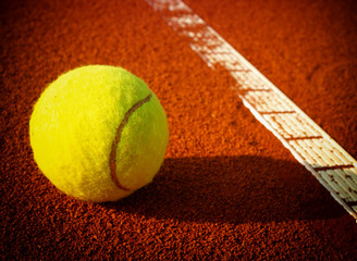 Tennis balls on a tennis clay court