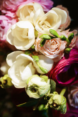 Beautiful close-up of a flower arrangement or bouquet with colorful flowers. Decoration of wedding reception or bridal bouquet. Macro shot flowers with selective focus