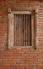 Striped brick walls and wooden window is used as the background.