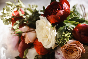 Beautiful close-up of a flower arrangement or bouquet with colorful flowers. Decoration of wedding reception or bridal bouquet. Macro shot flowers with selective focus