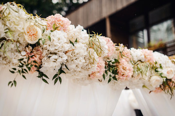 Beautiful close-up of a flower arrangement or bouquet with colorful flowers. Decoration of wedding reception or bridal bouquet. Macro shot flowers with selective focus
