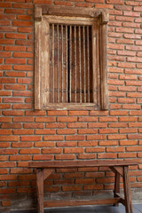 Fototapeta na wymiar Striped brick walls and wooden window is used as the background.