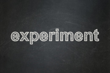 Science concept: text Experiment on Black chalkboard background