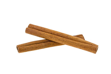 two cinnamon sticks on a white background