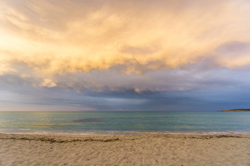 Fototapeta na wymiar Mallorca, Stormy shiny sky cloudscape at dawn at beach