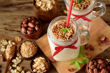 Protein cocktail with peanuts in a glass jar