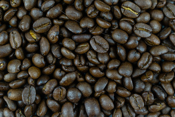 close up,pile of medium or dark roasted coffee beans. can be used as a background or graphic object in your ads.