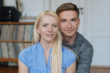 Attractive young couple posing looking at camera