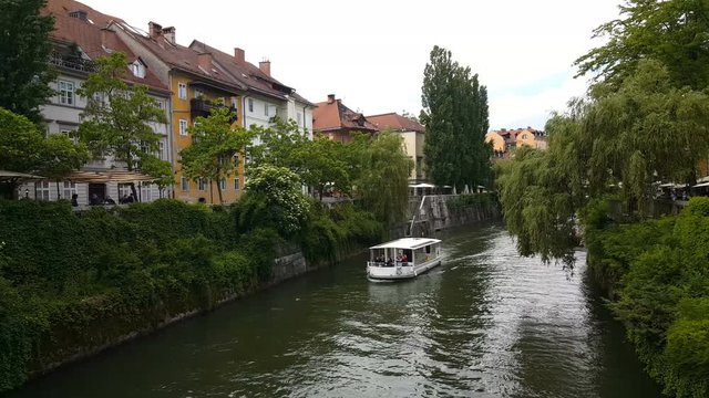 Tourist boat floating on Ljublanica river, Slovenia
