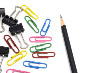 top view pencil with colorful paper clip, black paper clip. Desk office concept, copy space, isolated on white background