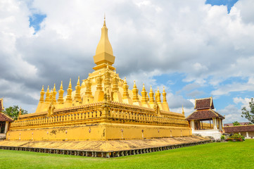 Fototapeta na wymiar The Pha That Luang stupa is the symbol of the city of Vientiane, the capital of Laos. It's a huge golden stupa