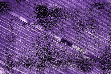 Grunge Ultra purple Texture of old, shabby, green paint on an old wooden with hole