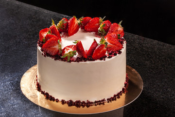 Cheesecake with strawberries. Cake decorated with strawberries. Delicious cheesecake decorated with fresh strawberries.