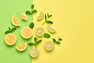 Vegan Organic Food Concept. Orange Citrus Lemon Fresh Fruit with Mint leaves. Creative Layout. Flat lay. Trendy fashion Style. Minimal Design Art. Hot Summer Vibes. Bright Color.