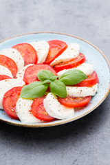 Classic caprese salad. Mozzarella tomatoes and  Basilikum.