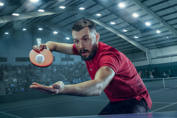 The table tennis player serving © master1305