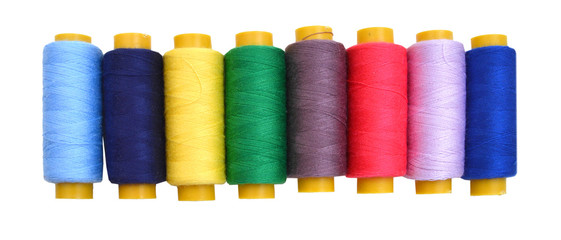 Color threads located as a rainbow isolated on white background