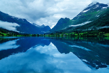 Naklejka na ściany i meble lake in norwegian fjords with reflection