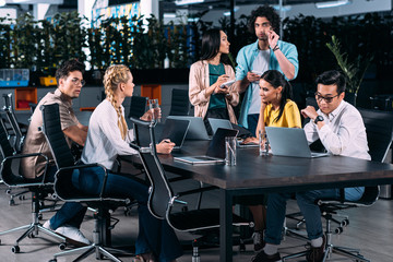 multiethnic business partners having meeting at table in modern office