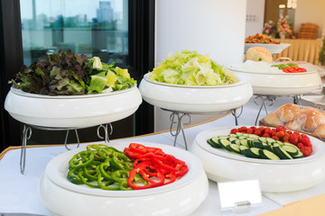 Salad bar vegetables in white bowl or plate for healthy food