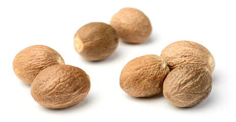 whole nutmeg isolated on white