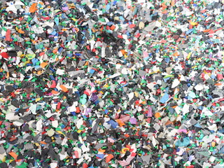 Shredded pieces of plastic in different colors