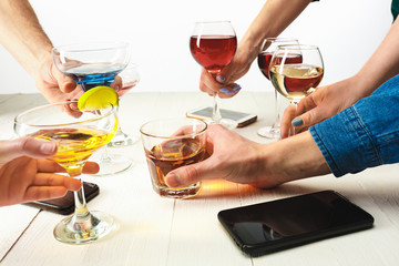 The male and female hands with exotic cocktails