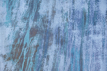 close up of faded abstract blue textured paint streak pattern