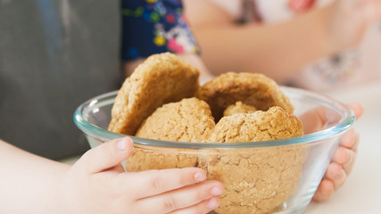 Little girl holds homemade cookies
