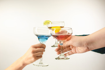 The male and female hands with exotic cocktails