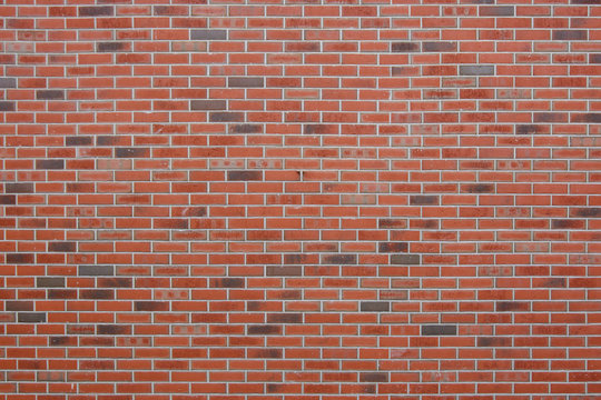 Fototapeta Red brick wall with elements of black