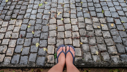 Woman foot on stone path