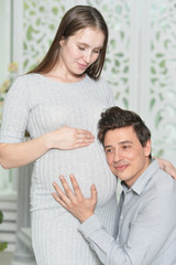happy pregnant woman with husband